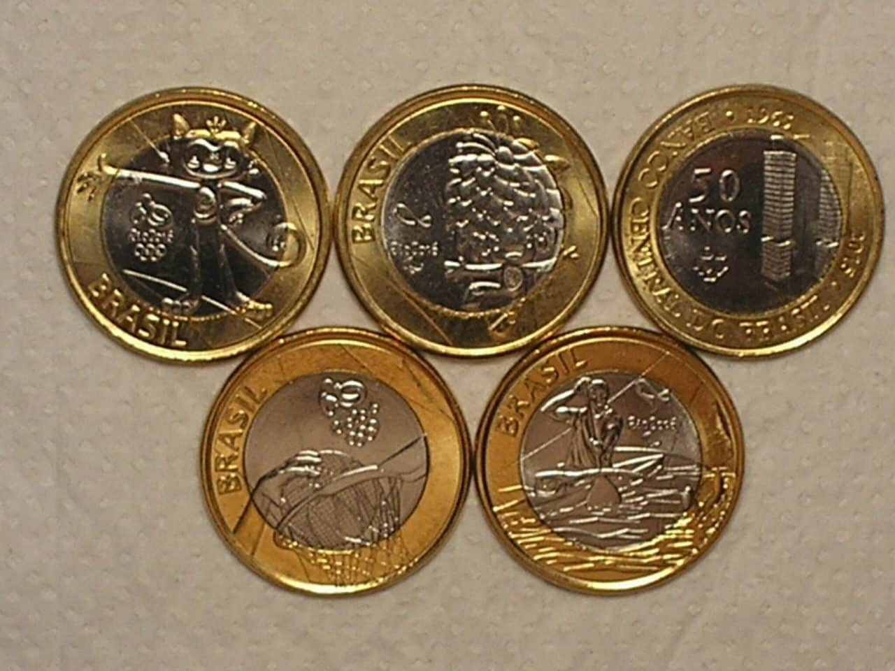 | Casa do Colecionador 5 Moedas Comemorativas das Olimpiadas 1 Real 2014/15 – Mascotes Gato e Cabeludo, Canoagem, Basquete e Bacen / Flor de Cunho / Cod. 170.14
