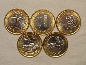 5 Moedas Comemorativas das Olimpiadas 1 Real 2014/15 - Mascotes Gato e Cabeludo, Canoagem, Basquete e Bacen / Flor de Cunho / Cod. 170.4