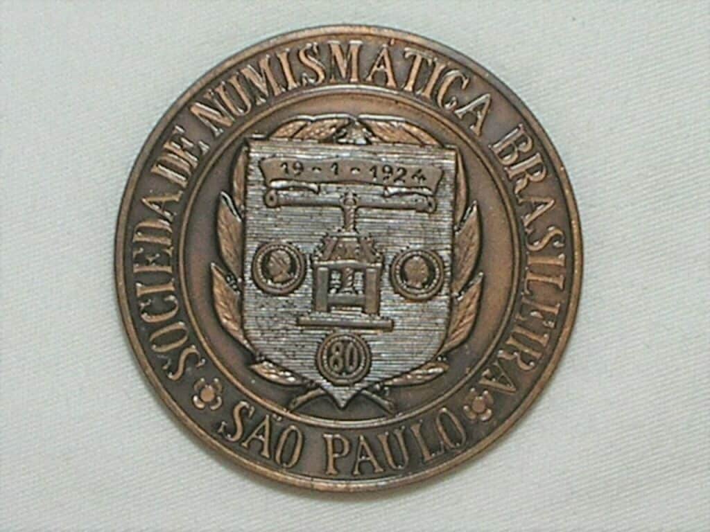| Casa do Colecionador Medalha da SNB comemorativa do 1º congresso Latino Americano de Numismática de S. Paulo em 2003, reprodução da moeda rara Carimbo de Minas S/ Colunário 8 reales / Bronze / 57 gramas / 56 mm. / Flor de cunho