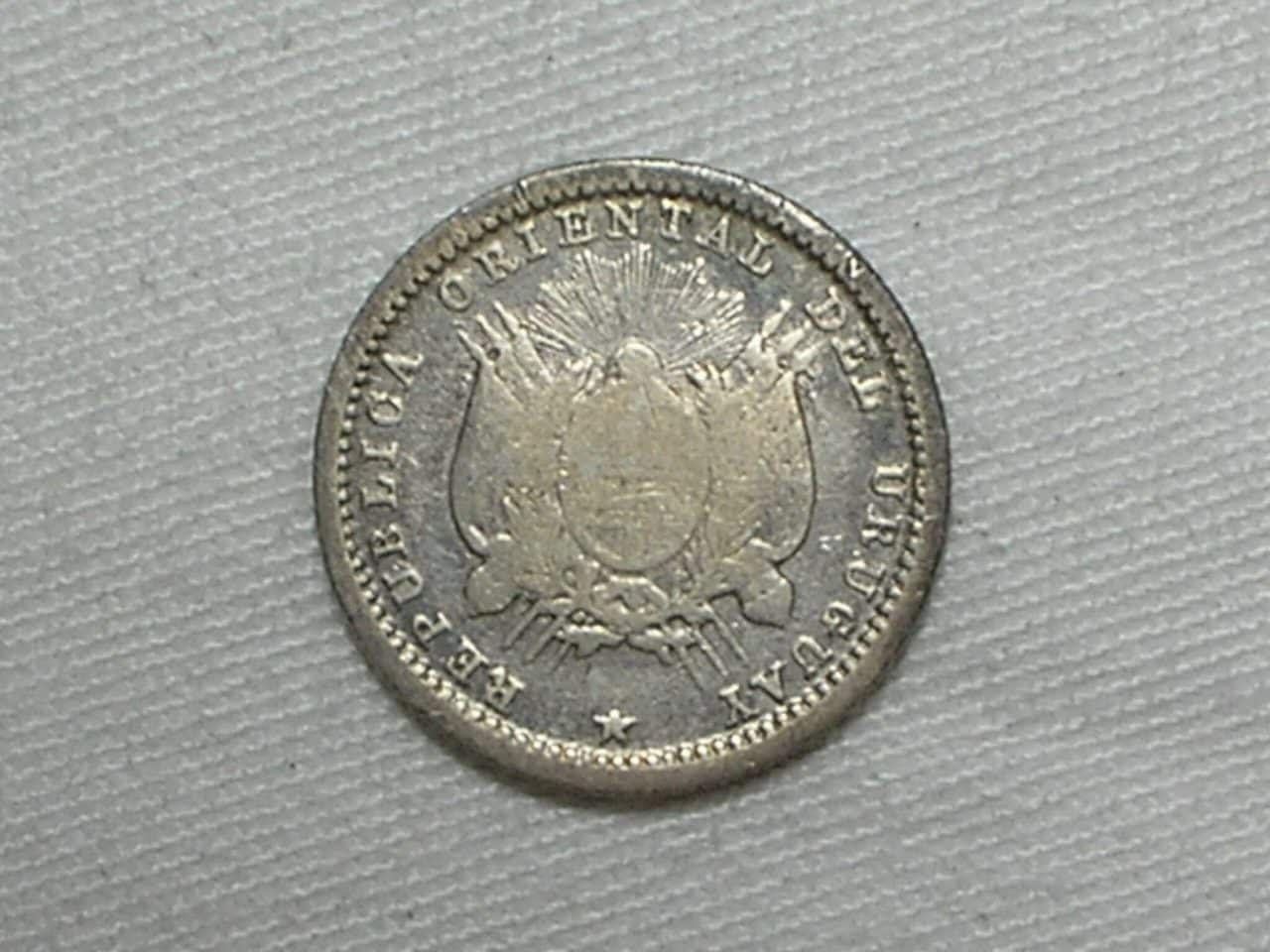 | Casa do Colecionador Uruguai) 10 Centimos - 1877-a / Prata / Escassa / m30.2
