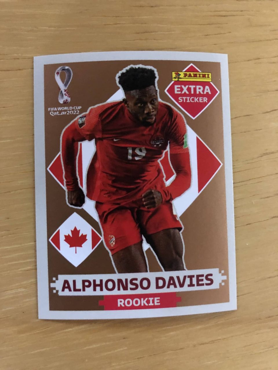 | Casa do Colecionador Figurinha Extra Rookie Panini Copa do Mundo 2022 Alphonso Davies Bronze