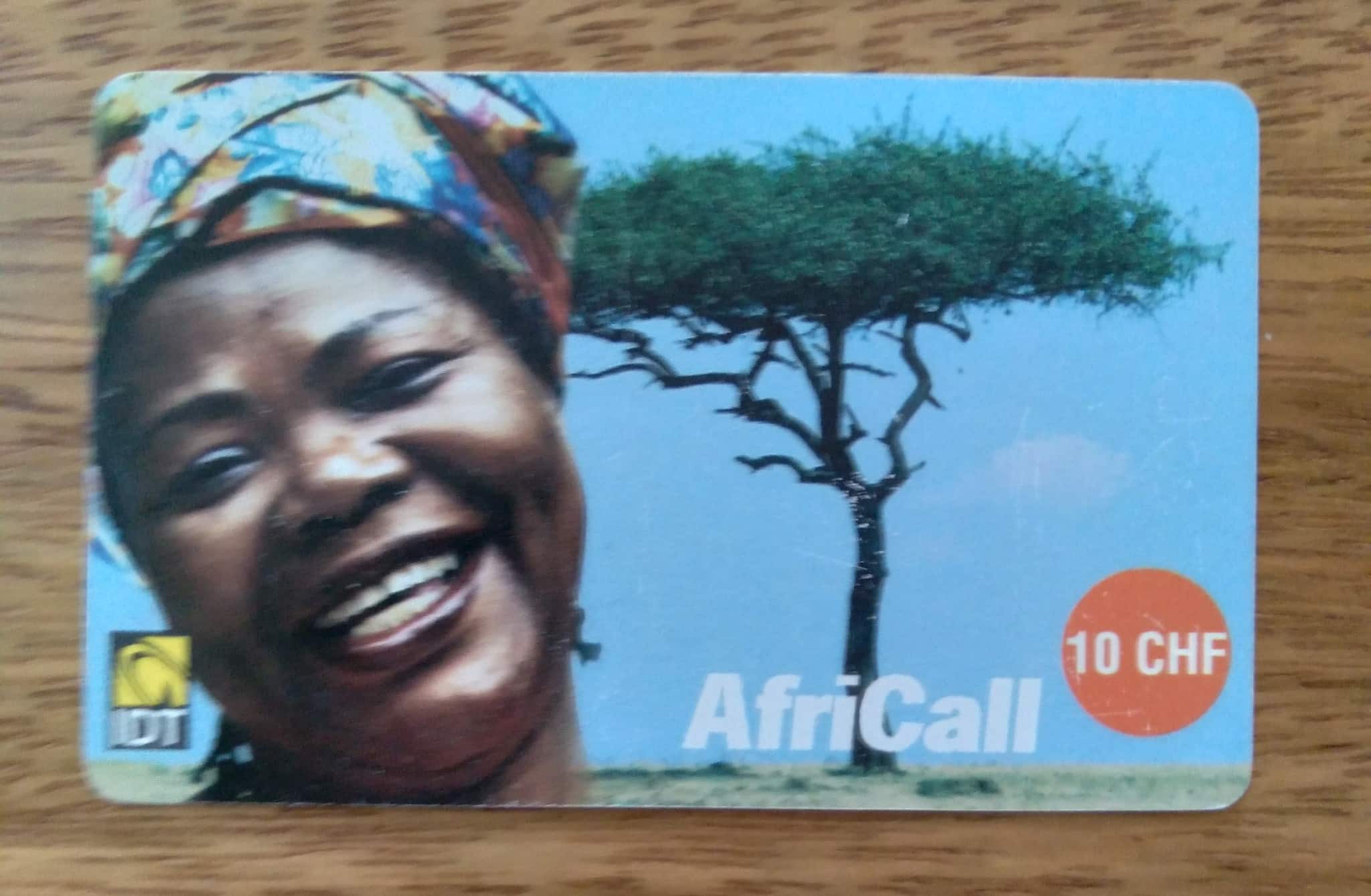 | Casa do Colecionador Cartão telefone Recarga IDT Africall. Mulher árvore e símbolo.
