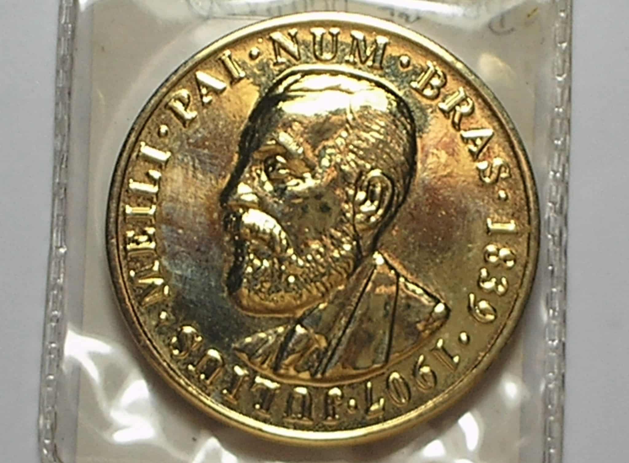 | Casa do Colecionador Medalha Importante de Julius Meili - pai da Numismática, do II Encontro Internacional de Numismática no Rio de Janeiro, no Htl Novo Mundo em 1996, 1 Onça Bronze dourado, Flor de cunho / Exemplar raro
