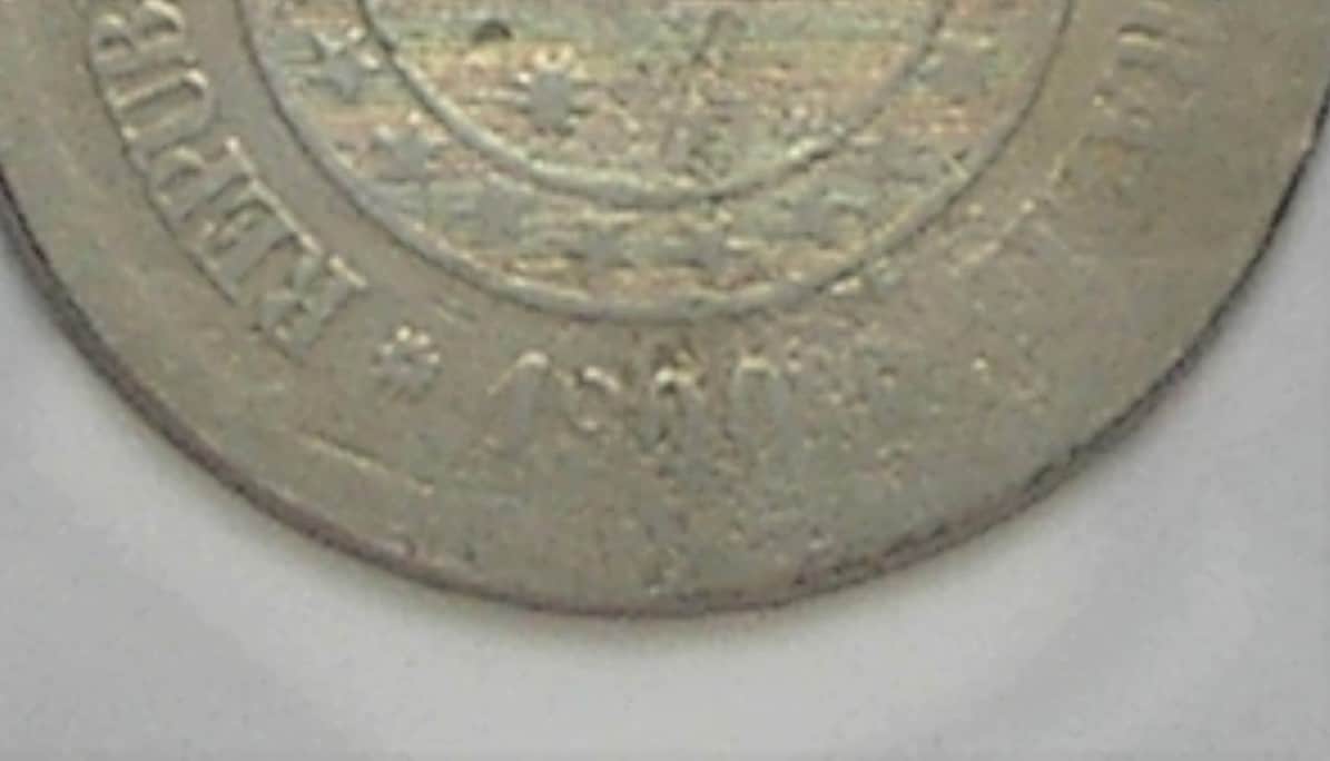 | Casa do Colecionador " 100 Réis - 1900 *** Reverso Inclinado - Catalogada - Peça raríssima *** cupro e niquel / República - Peça pra coleção - Pode se ver a inclinação na primeira foto comparando com a segunda foto.