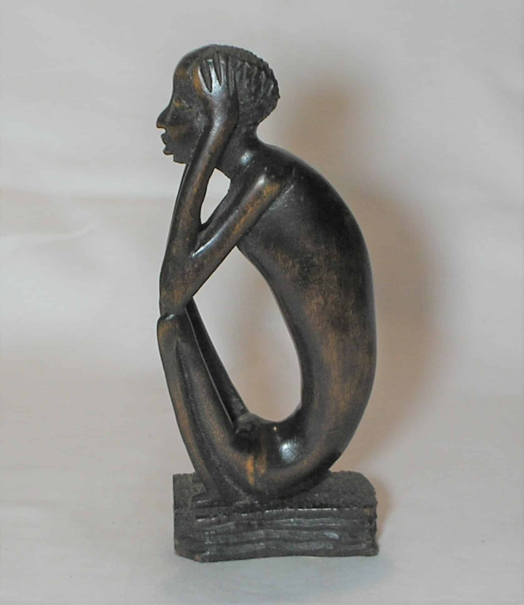 | Casa do Colecionador Escultura esculpida e talhada em madeira no estilo Africano sentado
