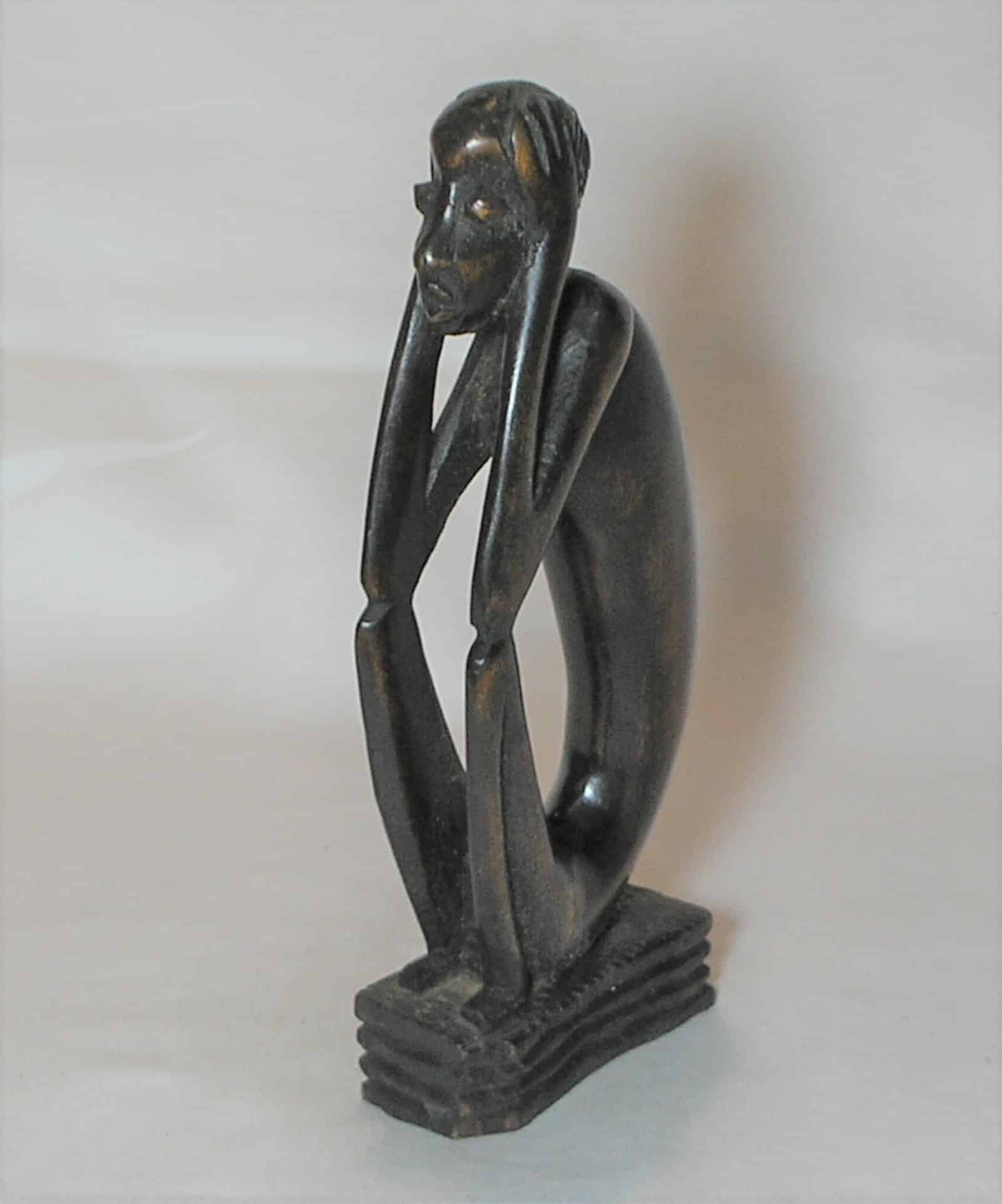 | Casa do Colecionador Escultura esculpida e talhada em madeira no estilo Africano sentado