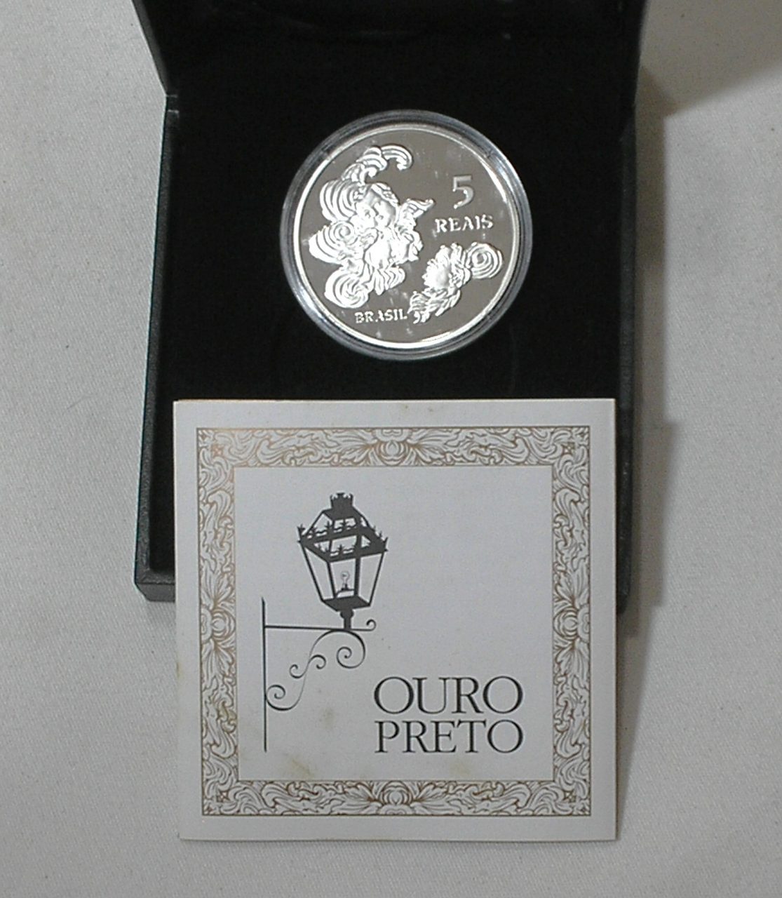 | Casa do Colecionador Estojo Original do Banco Central) 5 Reais - 2010 / Patrimônio da Humanidade - Unesco - Ouro Preto / Prata .925 / Muito rara / Flor de Cunho / Com certificado