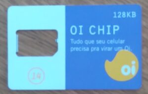 24MCartão telefone Porta Chip Oi 128 Kb branco e roxo.