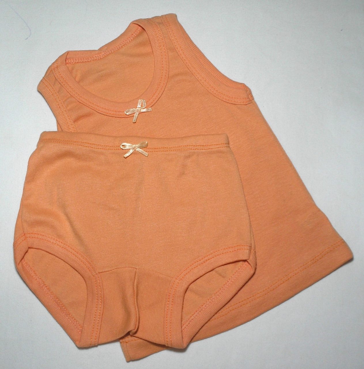 | Casa do Colecionador Conjunto Body com shortinho na cor Rosa em malha com detalhe em lacinho, veste menina de 1 a 3 meses