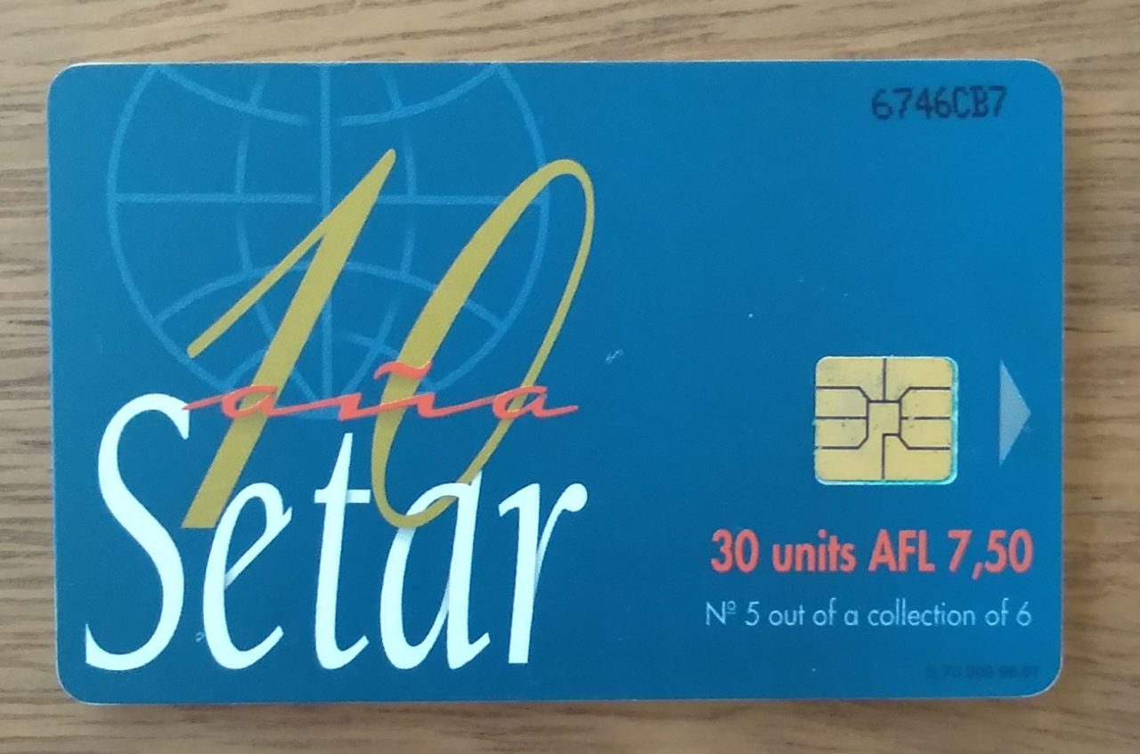 | Casa do Colecionador Cartão telefone Aruba Setar Chip 1996. Painel aniversário Antena parabólica.