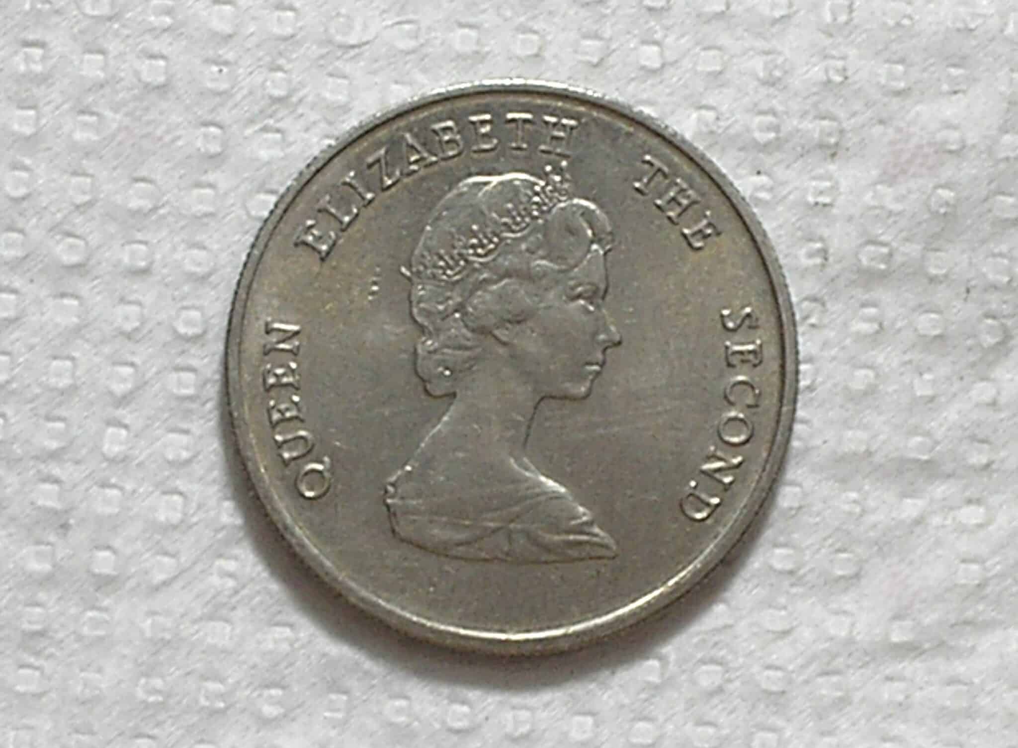 | Casa do Colecionador East Caribbean State) 25 Cents - 1986 / 24mm / Co/Ni / Flor de Cunho / box53