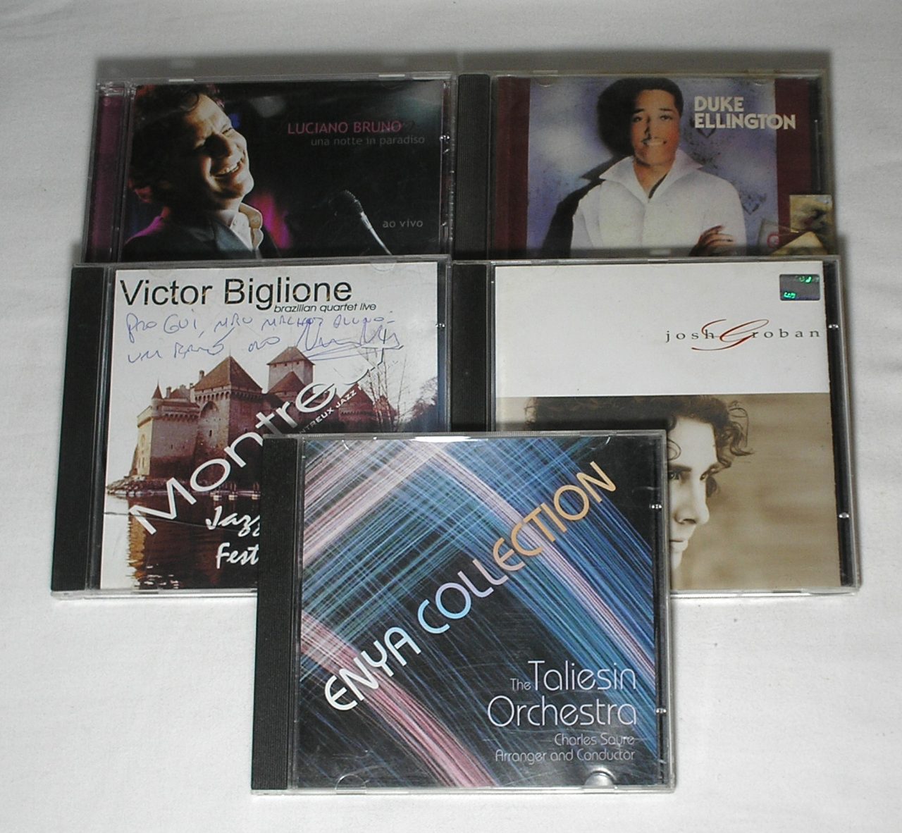 | Casa do Colecionador Cinco CD's antigos da época - Grandes Sucessos da época - Enya Collection / Victor Biglione / Josh Groban / Luciano Bruno / Duke Ellington