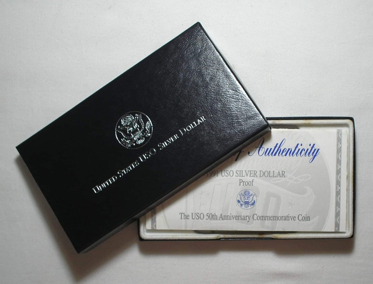 | Casa do Colecionador Usa) Estojo 1 Dollar - 1991-S "Comemorativa aos 50 anos do USO - United Service Organization" / Prata Proof / cod. ems.2