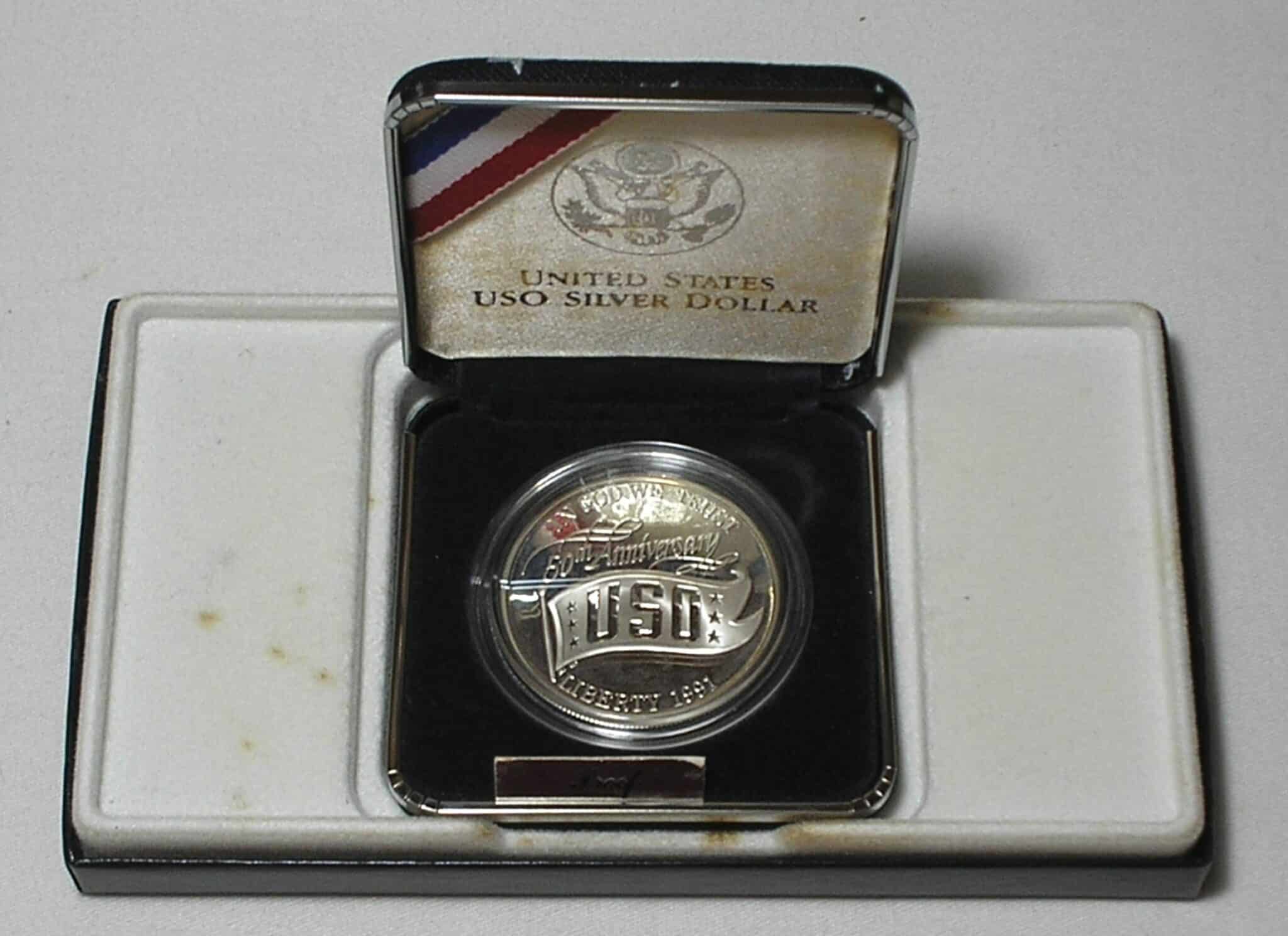 | Casa do Colecionador Usa) Estojo 1 Dollar - 1991-S "Comemorativa aos 50 anos do USO - United Service Organization" / Prata Proof / cod. ems.2