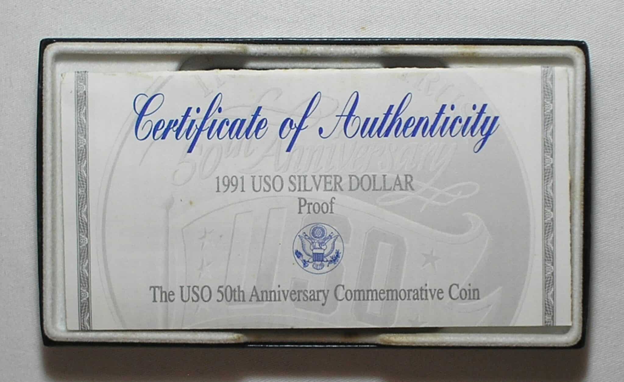 | Casa do Colecionador Usa) Estojo 1 Dollar - 1991-S "Comemorativa aos 50 anos do USO - United Service Organization" / Prata Proof / cod. ems.2