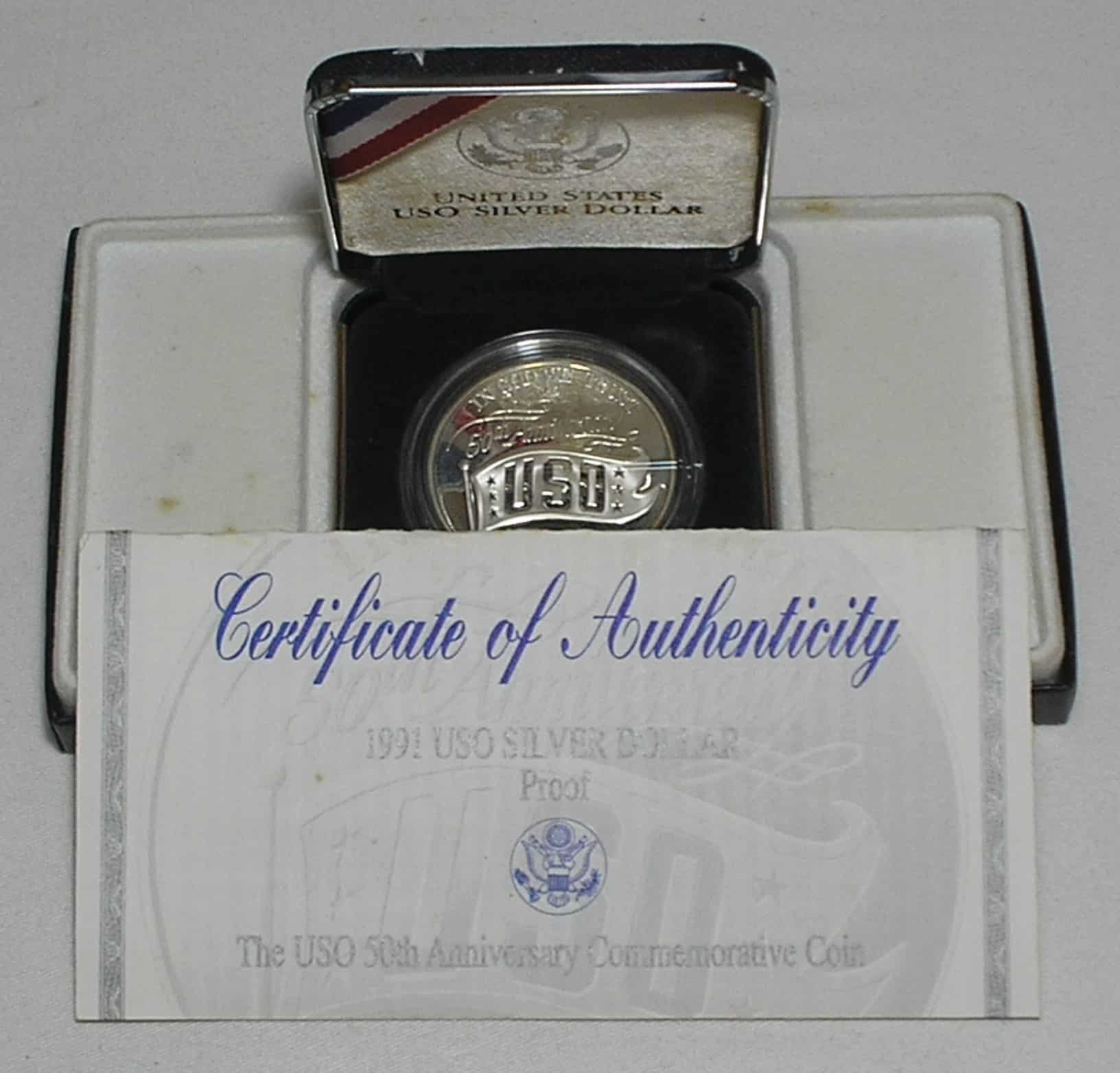 | Casa do Colecionador Usa) Estojo 1 Dollar - 1991-S "Comemorativa aos 50 anos do USO - United Service Organization" / Prata Proof / cod. ems.2