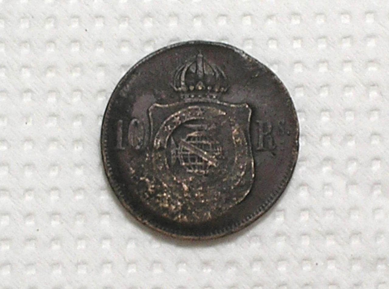 | Casa do Colecionador 10 Réis - 1869 / Carimbo do Divino - a pomba voando / Bronze - Império Petrus II / Mbc / m470