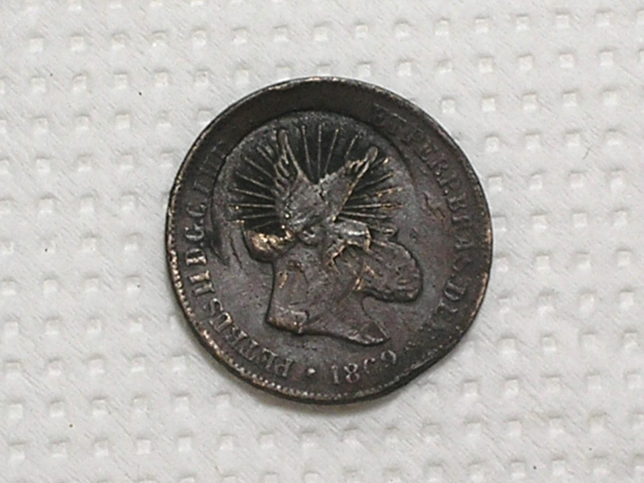 | Casa do Colecionador 10 Réis - 1869 / Carimbo do Divino - a pomba voando / Bronze - Império Petrus II / Mbc / m470