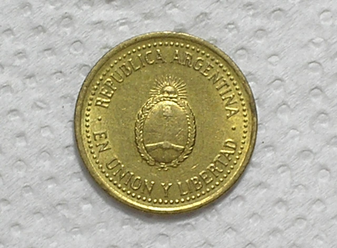 | Casa do Colecionador Argentina) 10 Centavos - 1992 / Carimbo Piratini / Fc / Bz-Al / box57.3