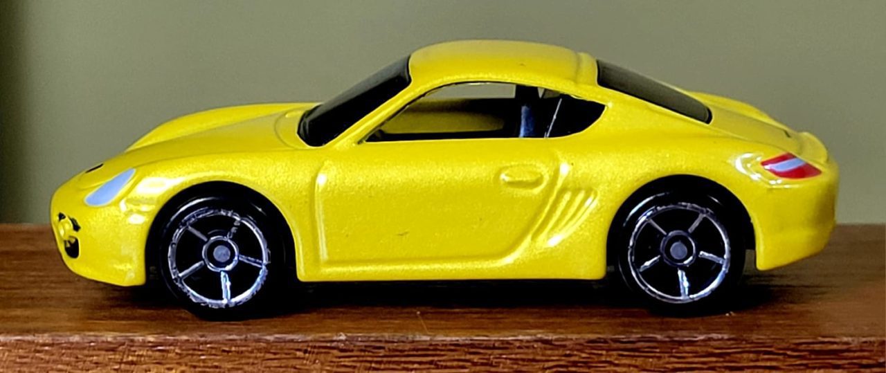 | Casa do Colecionador Hot Wheels Porsche Cayman S Amarelo (1ª Edição) Ano 2008