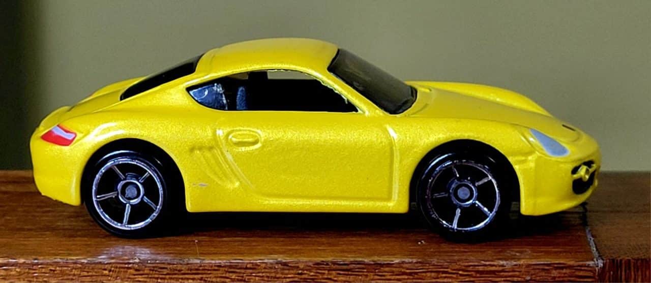 | Casa do Colecionador Hot Wheels Porsche Cayman S Amarelo (1ª Edição) Ano 2008