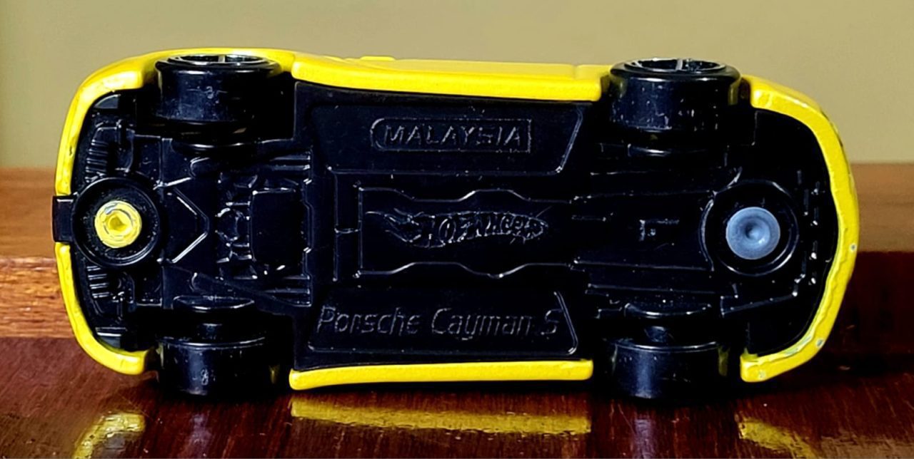 | Casa do Colecionador Hot Wheels Porsche Cayman S Amarelo (1ª Edição) Ano 2008