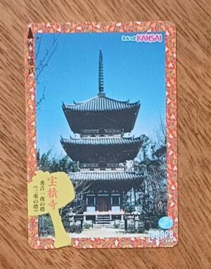 5ab. Passagem Japão. Trem Kansai Lagare card. Templo Hoshakuji torre a noite.