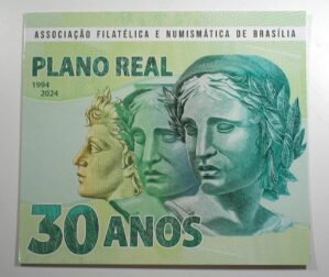 . Folder com Cédula e Moeda da Associação Numismática e Filatélica de Brasília Representando os 30 anos do Plano Real - 1994 a 2024 / Flor de Estampa e Flor de Cunho