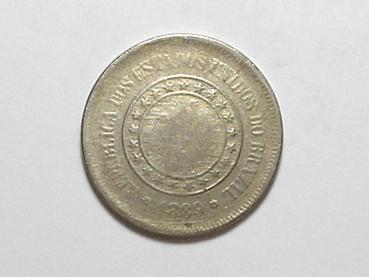 | Casa do Colecionador 100 Réis - 1889 - Cunho raso e rachado - República / Níquel / Mbc