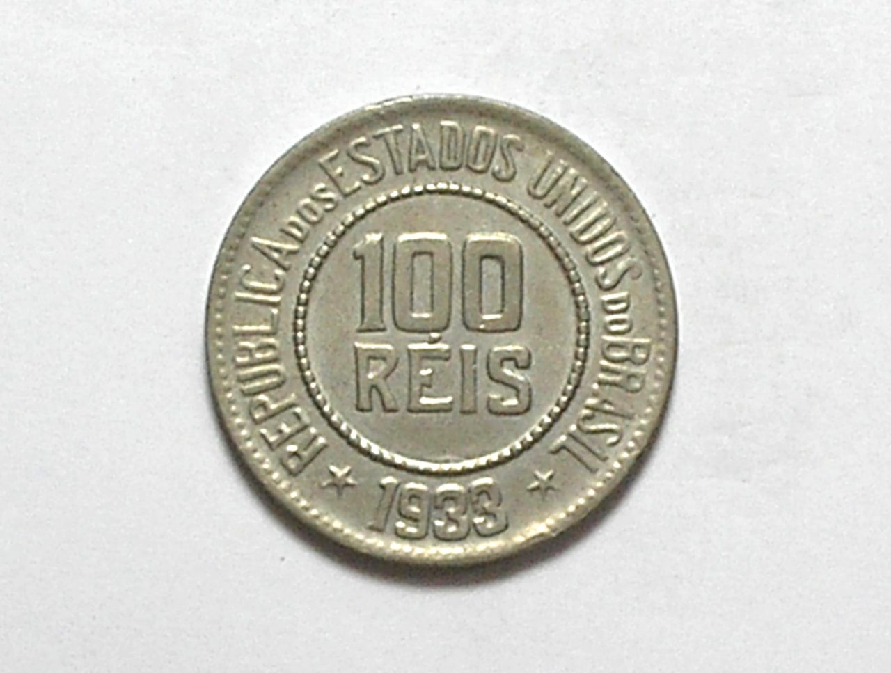 | Casa do Colecionador 100 Réis - 1933 / Escassa / Sob/Flor - raro no estado / República / Níquel