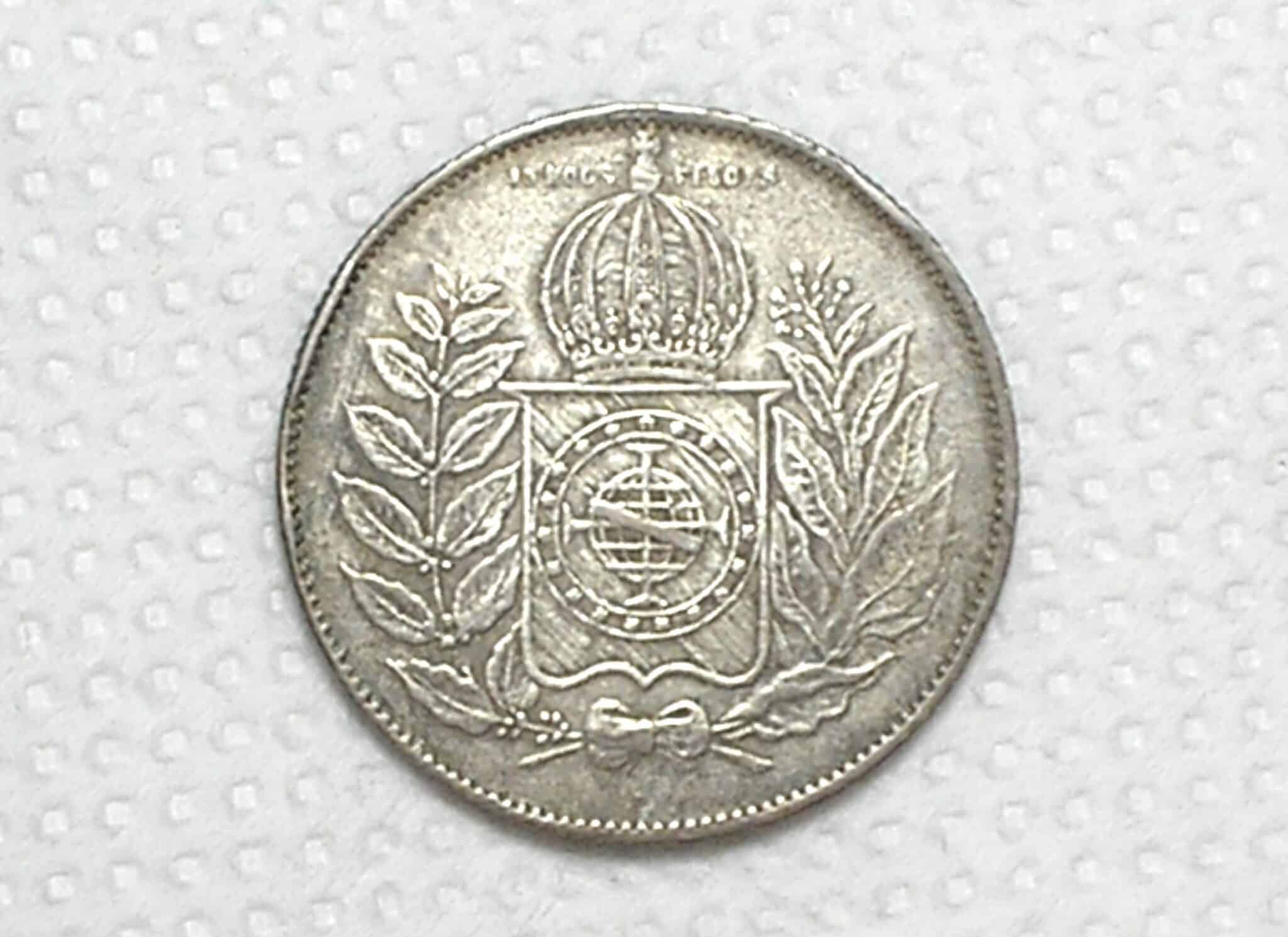 | Casa do Colecionador 1.000 Réis - 1852 / Cunho raso - Data nº 2 Largo - Catalogada pelo Vinícius / Império / Mbc/Sob / Prata / Cod.Alb