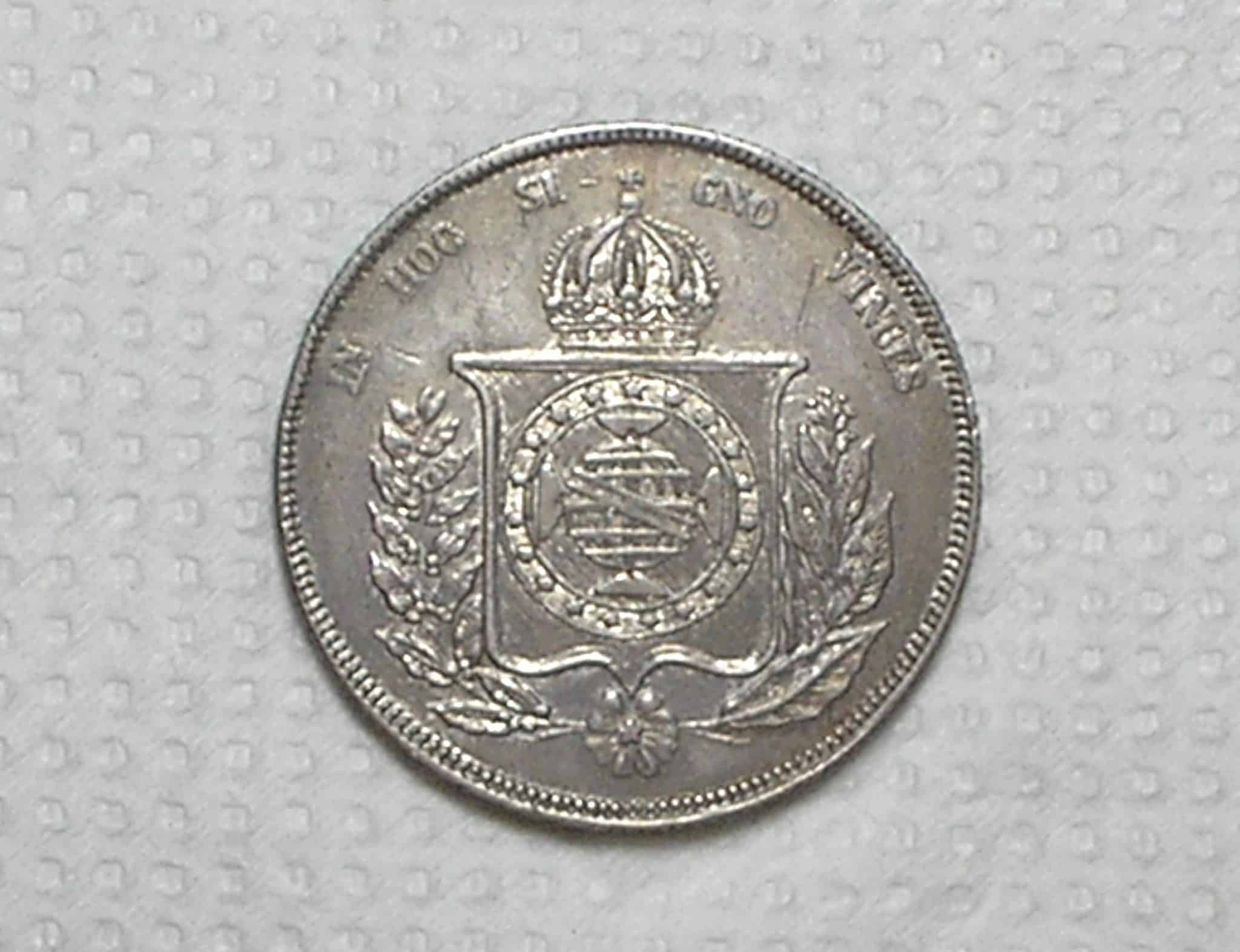 | Casa do Colecionador 1.000 Réis – 1854 / Esfera Armilar e Galho Esquerdo Duplo / Mbc/Sob / Prata / cod.450.1