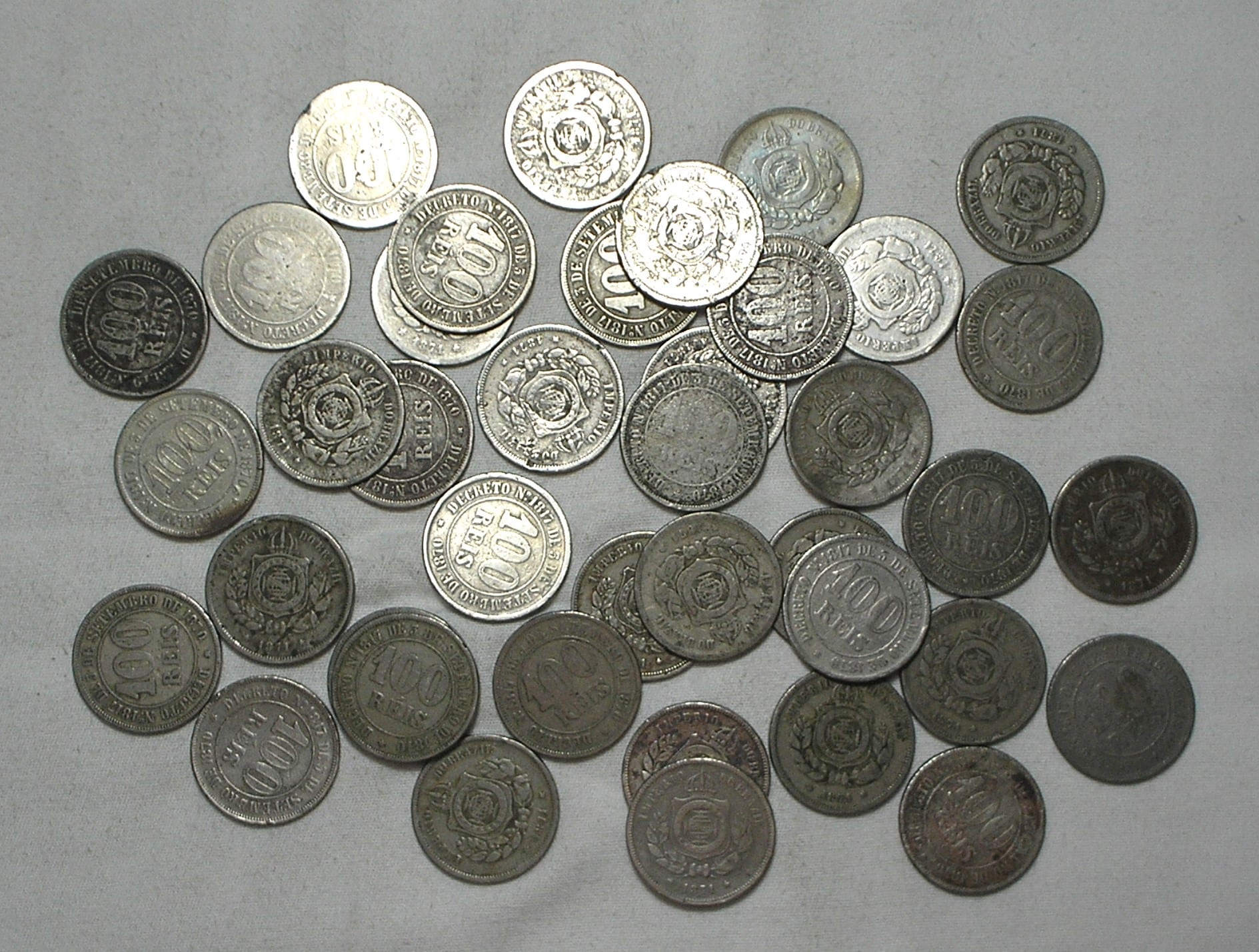 | Casa do Colecionador 40 Moedas de 100 Réis de 1871 Império - Peças dificeis - Queima de estoque