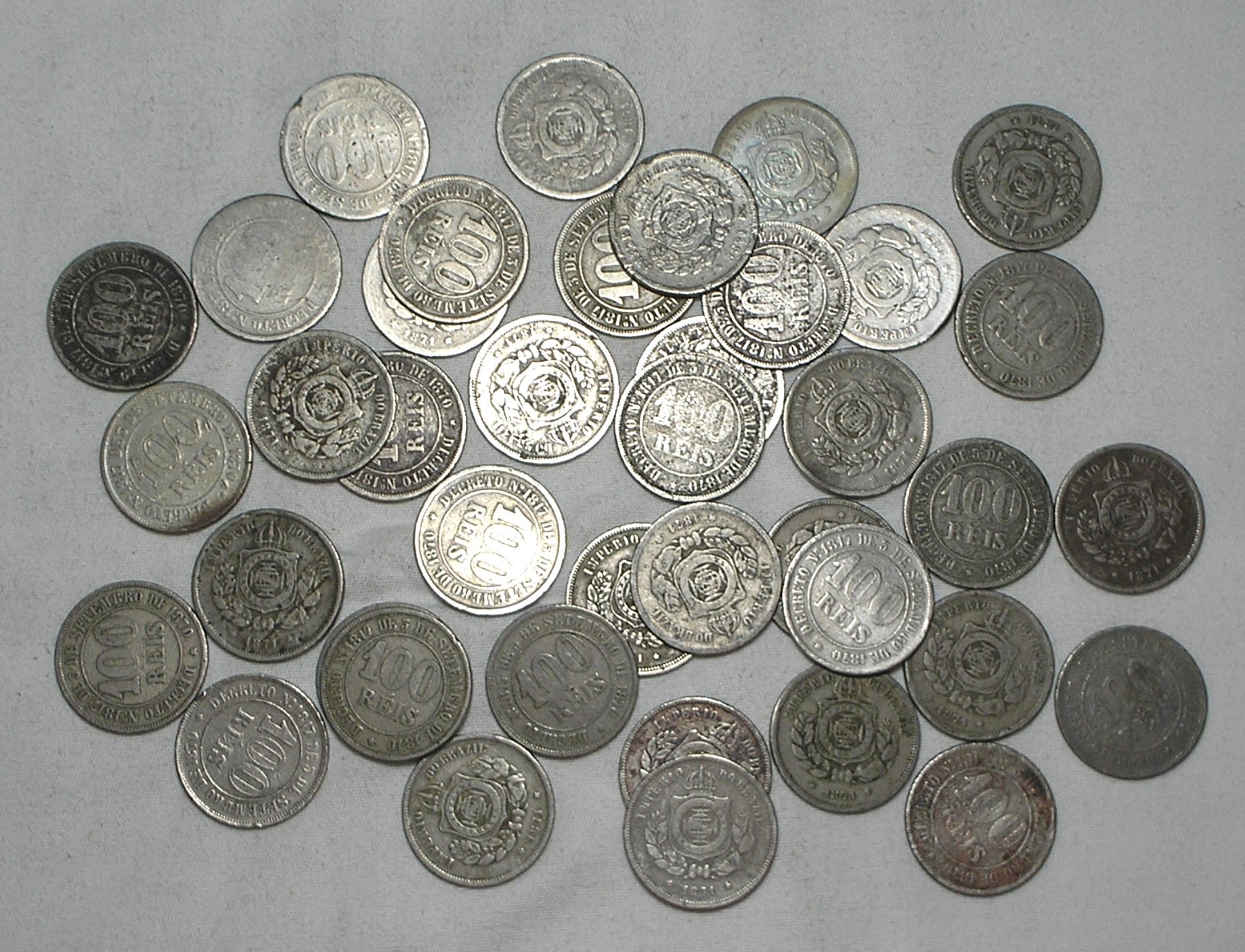 | Casa do Colecionador 40 Moedas de 100 Réis de 1871 Império - Peças dificeis - Queima de estoque
