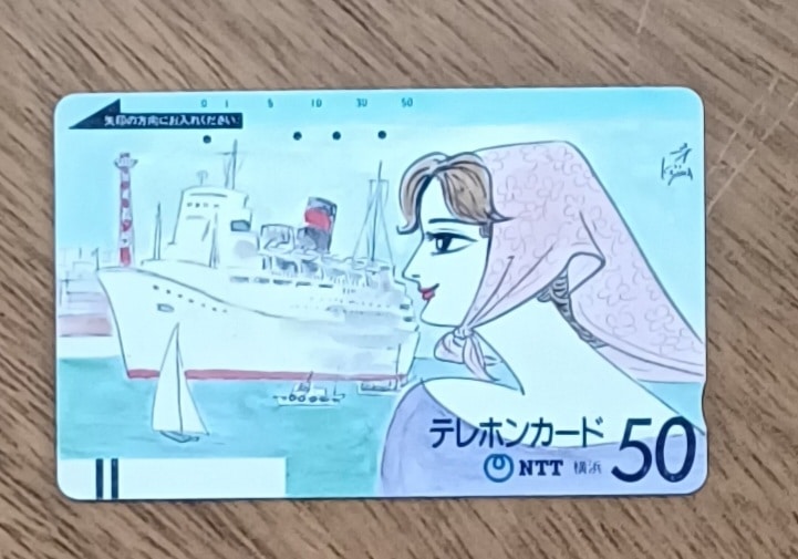 | Casa do Colecionador I26. Cartão telefone Japão Ntt 250. Yokohama navio mulher com lenço.