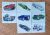 Figurinhas Hot wheels brancas sem número a escolher.