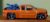 Hot Wheels Chevrolet Silverado Laranja com Moto (First Edition – 1ª Edição) Ano 2007